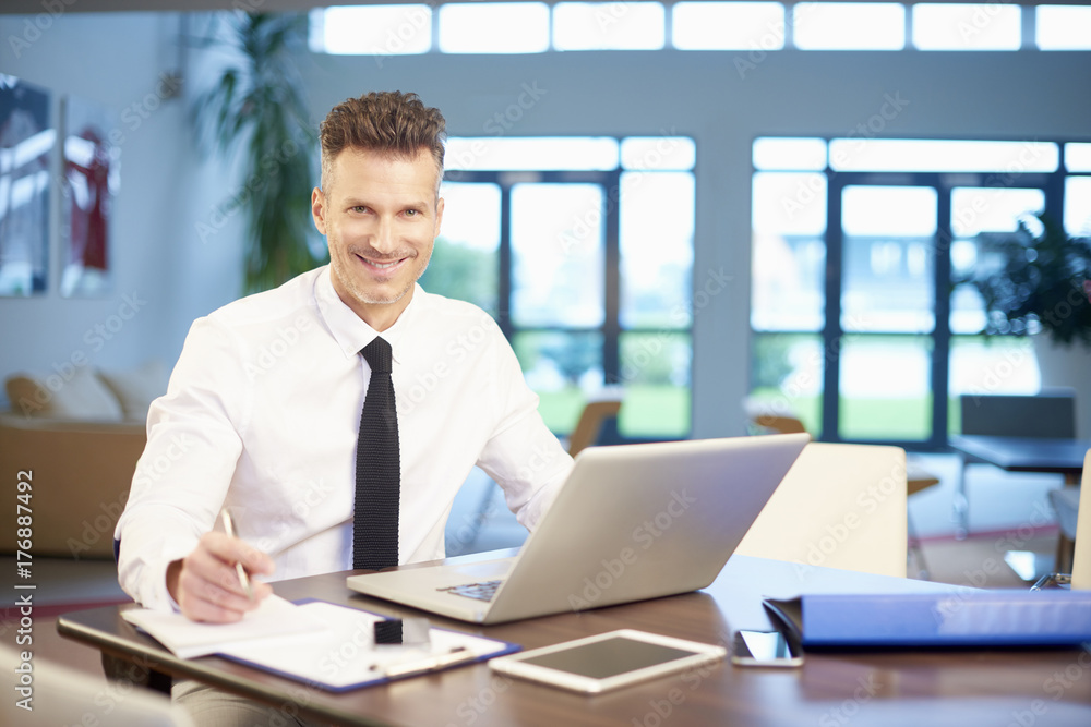 Businessman working on new project on laptop at office Businessman working on new project on laptop at office