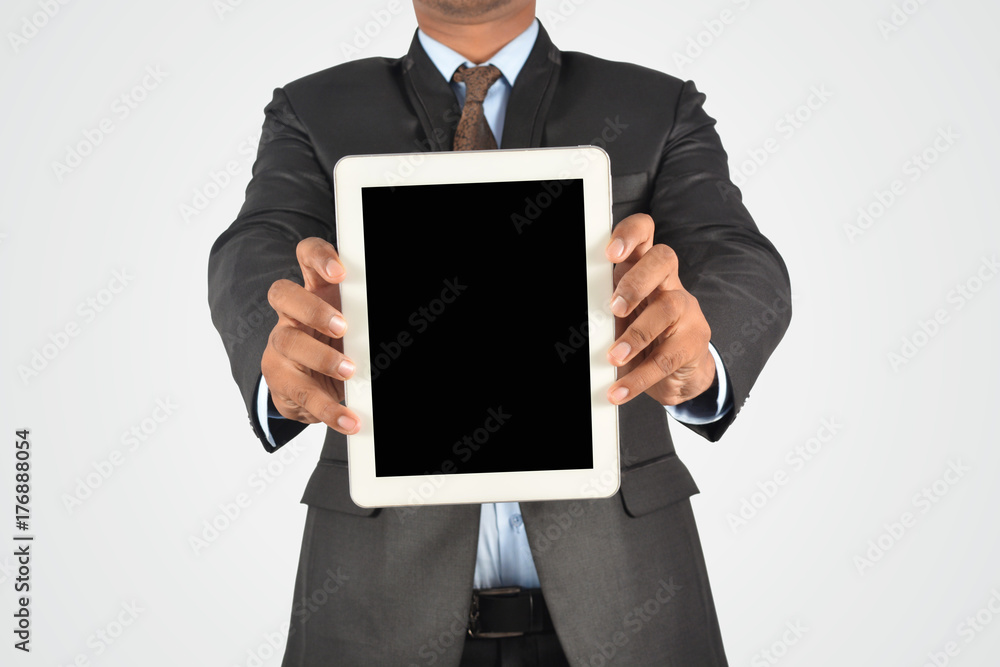 Businessman holding blank digital tablet pc, isolated very professionally Businessman holding blank digital tablet pc, isolated very professionally