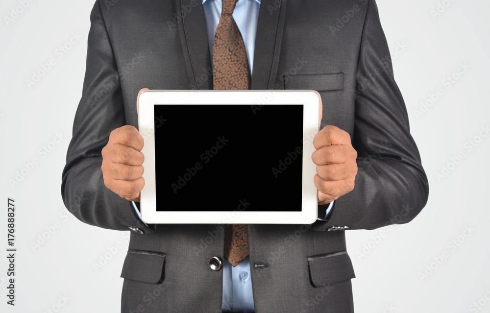 Businessman holding blank digital tablet pc, isolated very professionally Businessman holding blank digital tablet pc, isolated very professionally