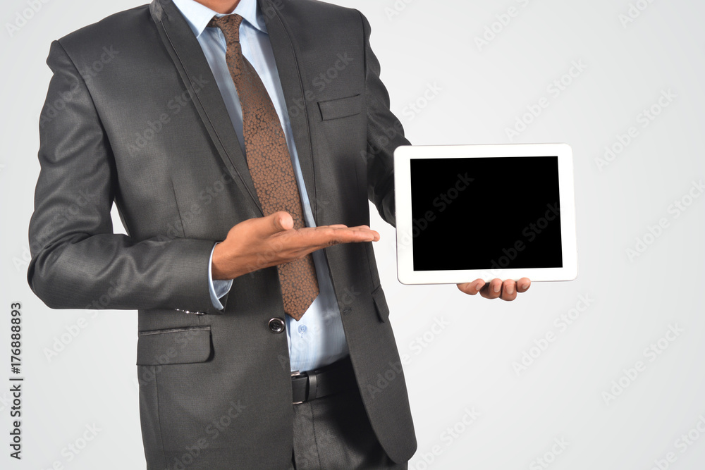 Businessman holding digital tablet pc, isolated very professionally Businessman holding digital tablet pc, isolated very professionally