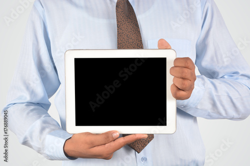Businessman holding digital tablet pc, isolated very professionally