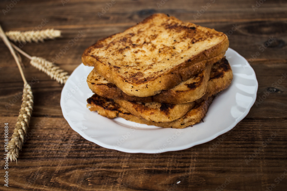 stack of french toast on wooden background stack of french toast on wooden background