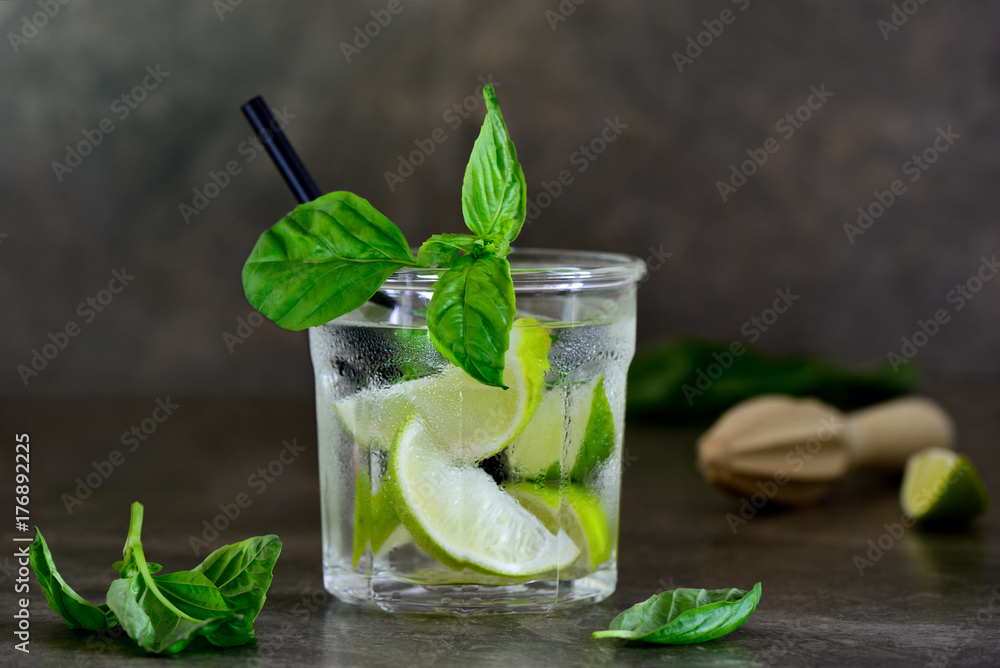 Fototapeta premium Basil limeade or alcohol cocktail in a glass