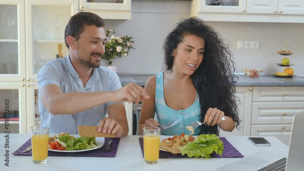 Husband and wife have breakfast at the kitchen Husband and wife have breakfast at the kitchen