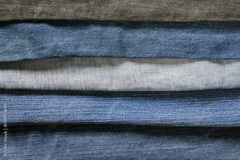 stylish textured background from horizontal strips of denim in different shades