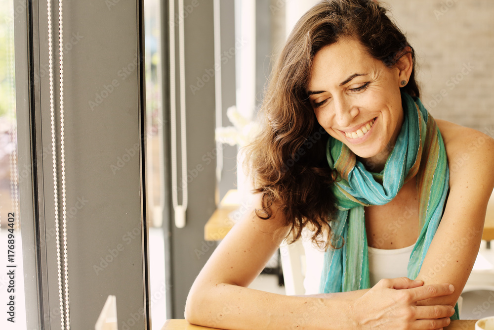 Portrait of beautiful 40 years old woman sitting in the cafe Portrait of beautiful 40 years old woman sitting in the cafe