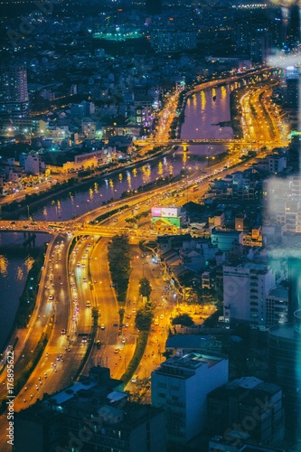 Saigon river in Ho Chi Minh city by night, Vietnam photo