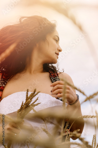 bottom view portrait of a girl in a field of rye