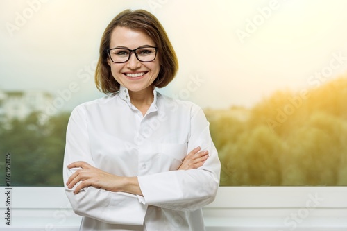 Portrait smiling medical woman doctor at Hospital photo