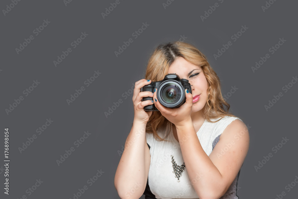 Young woman is taking a picture Young woman is taking a picture