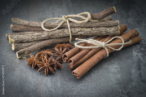 Star anise,cinnamon and licorice on grey background