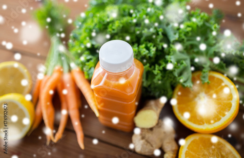 bottle with carrot juice  fruits and vegetables