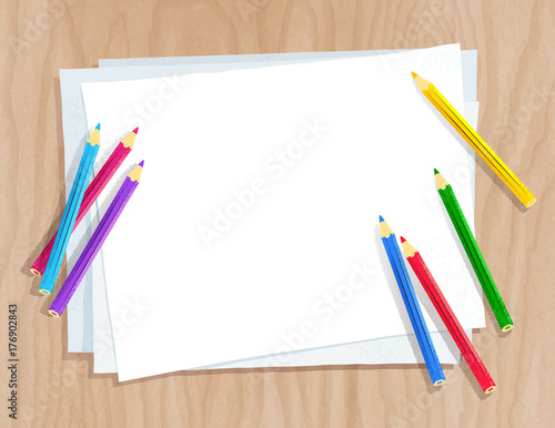 Color pencils lying on paper