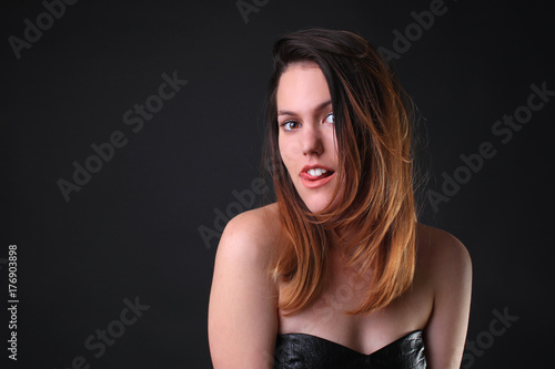 Seductive girl in a black dress seducing funny