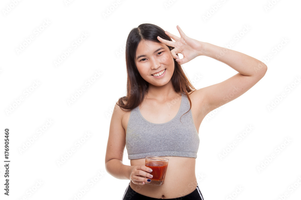 Beautiful healthy Asian girl show OK with tomato juice. Beautiful healthy Asian girl show OK with tomato juice.