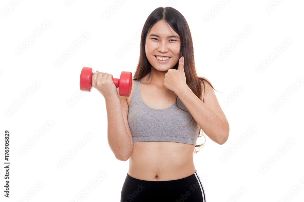 Beautiful Asian healthy girl thumbs up with dumbbell. Beautiful Asian healthy girl thumbs up with dumbbell.