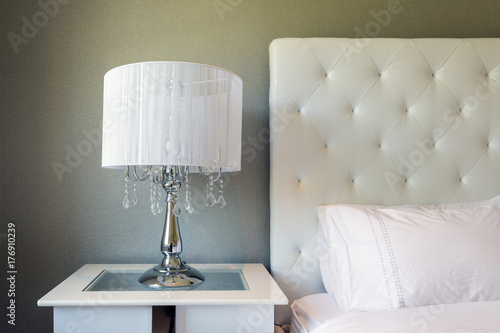 Contemporary bedside with white glitzy table lamp photo