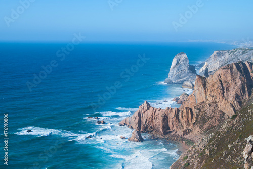 Ocean meets Cliffs of Cabo da Roca Cape Roca in Sintra - the westernmost extent of mainland Portugal and Europe.