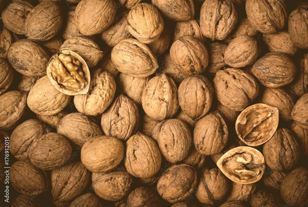 Whole Walnuts and half the kernel, food concept. Top view Whole Walnuts and half the kernel, food concept. Top view