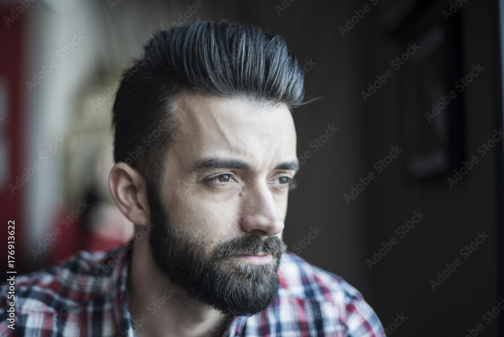 Close up portrait of a young good looking man thinking Close up portrait of a young good looking man thinking