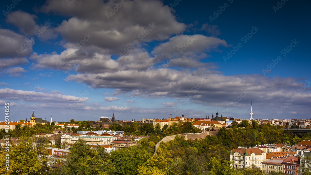 Lighten Prague during nice sunny day.  Clear blue sky over czech landmarks. Aerial view on Prague.