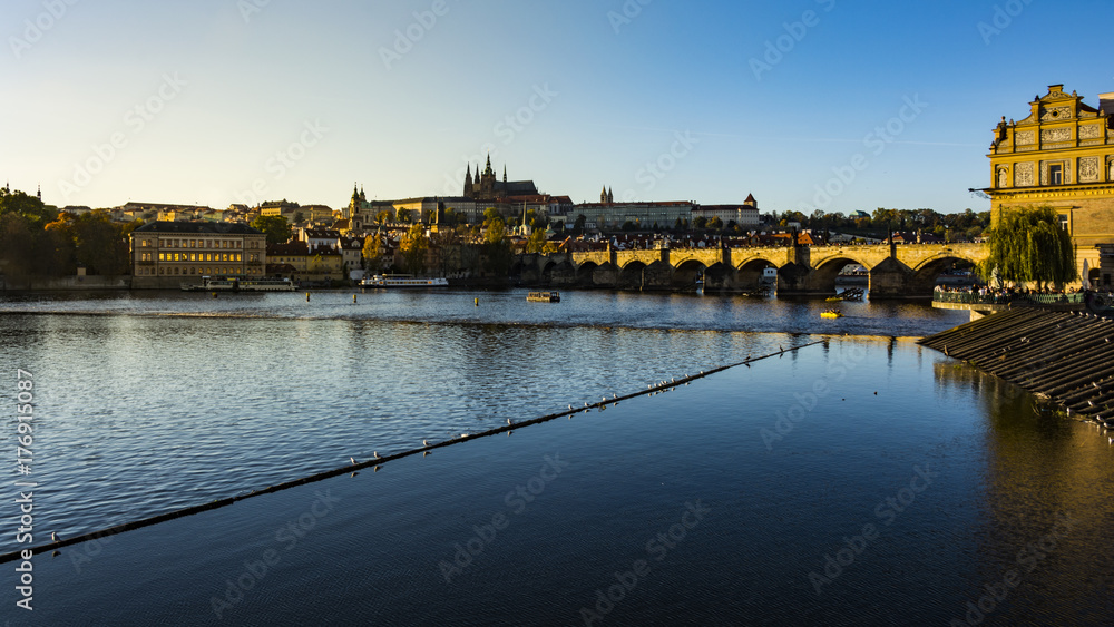 Lighten Prague during nice sunny day.  Light reflection in the river Vltava
