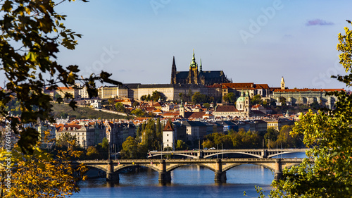 Lighten Prague during nice sunny day.  Clear blue sky over czech landmarks. © Petr