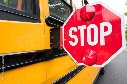 school bus stop sign on side of bus