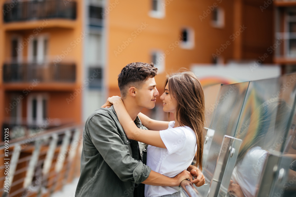 Couple hug and kissing dating on bridge Couple hug and kissing dating on bridge