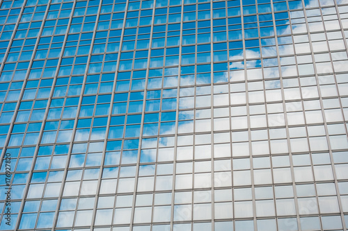 glass facade with cloud reflections