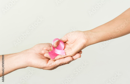 pink ribbon bow in hand