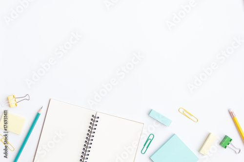 notebook paper, sticky note with pen, paper clip on white background