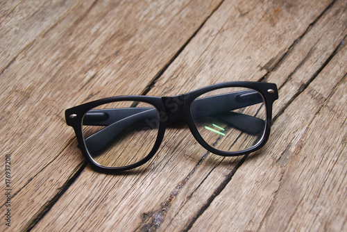 Eyeglasses Over Wooden Background