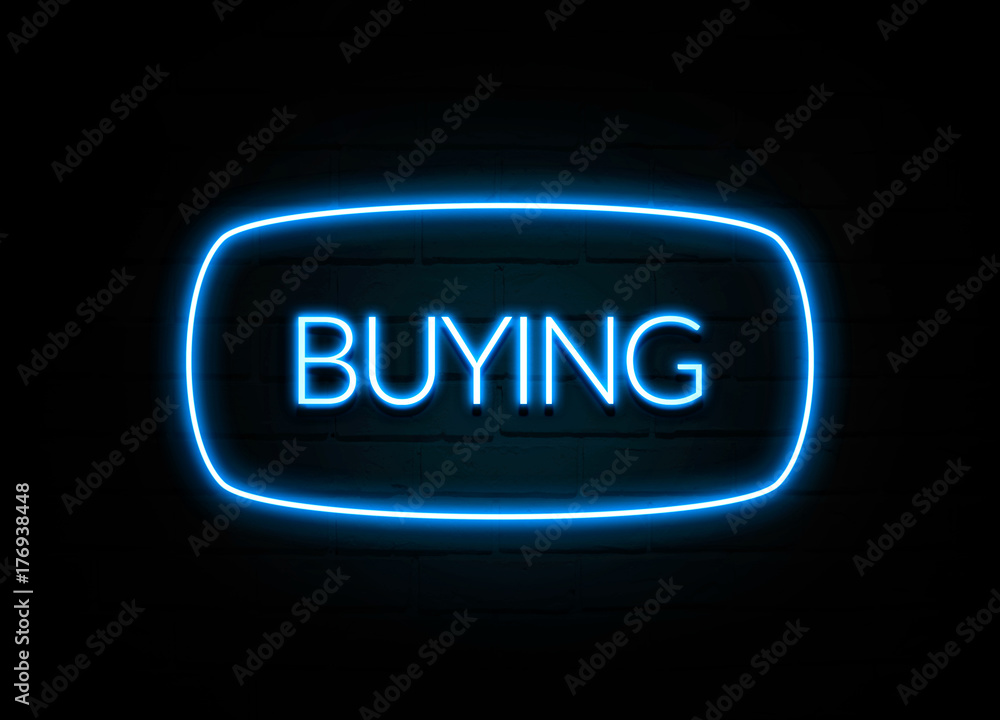 Buying - colorful Neon Sign on brickwall Buying - colorful Neon Sign on brickwall