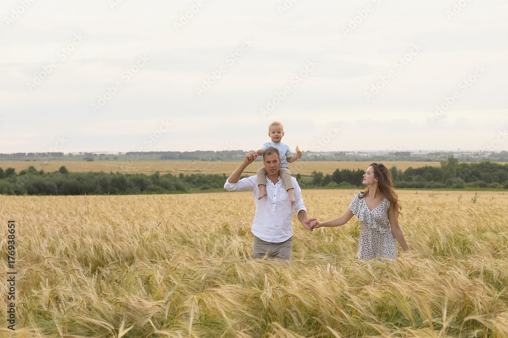 Happy childhood, family together on wheat field Happy childhood, family together on wheat field
