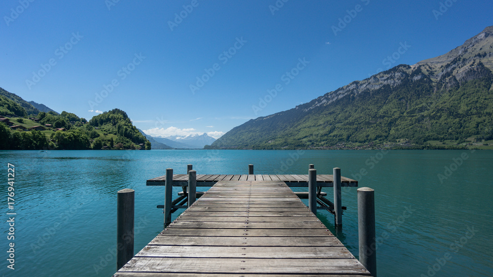 Pier into the lake Brienzersee in Iseltwald Switzerland Pier into the lake Brienzersee in Iseltwald Switzerland