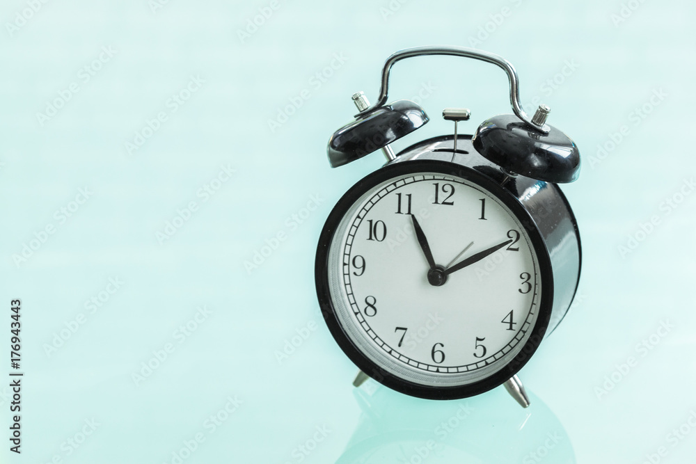 Retro alarm clock on a glass table