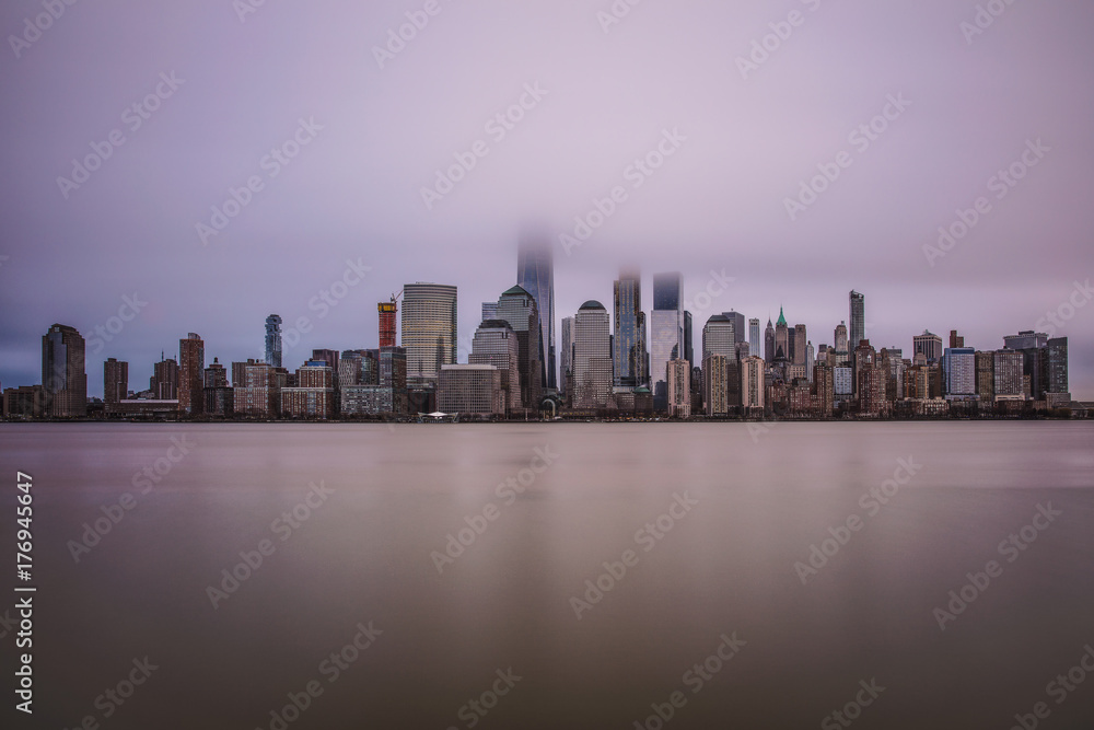 NYC skyline sunrise in dense fog