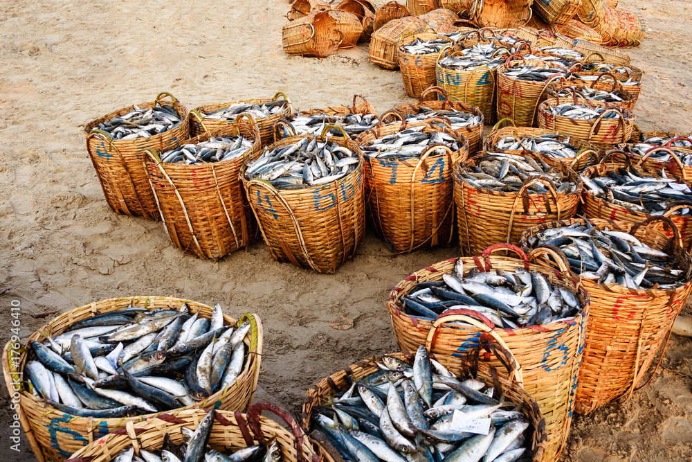 Bamboo basket at a traditional fish market on the beach in Long