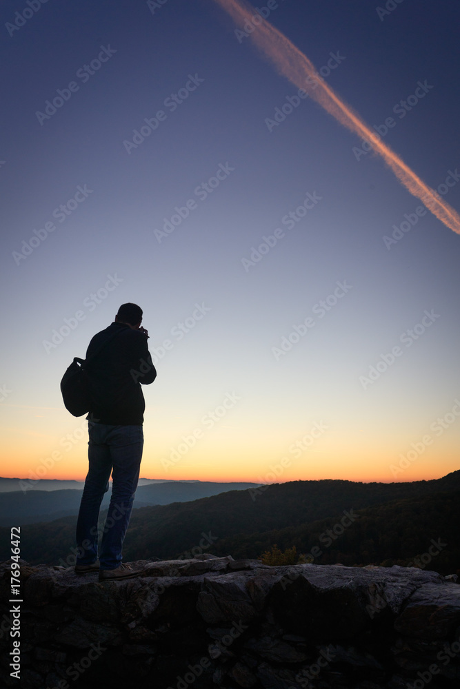 Silhouette of photographer at sunset