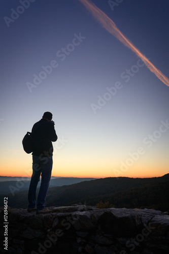 Silhouette of photographer at sunset