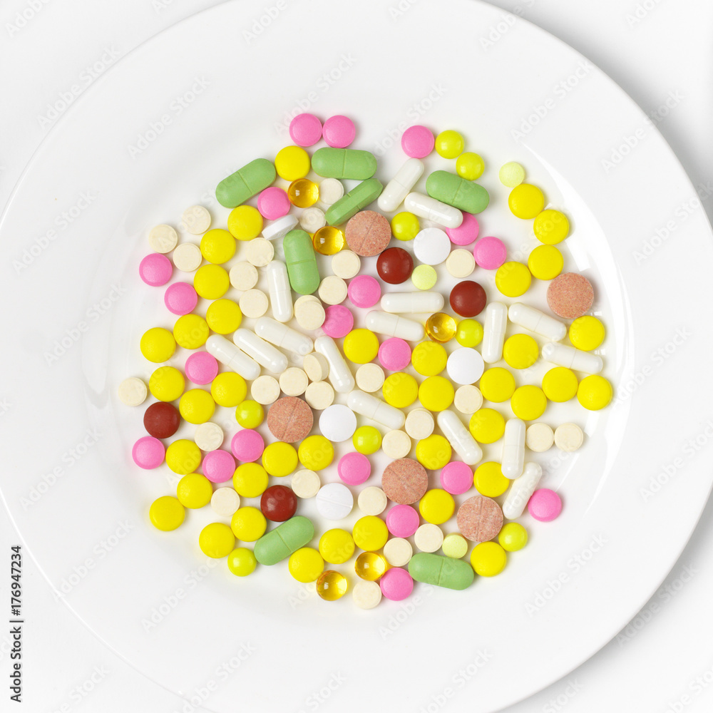 Colorful pills in plate Colorful pills in plate