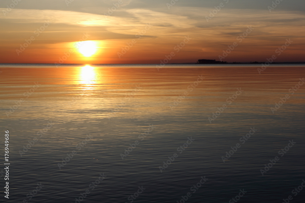 Sunset on the reservoir. Ob River, Siberia, Russia