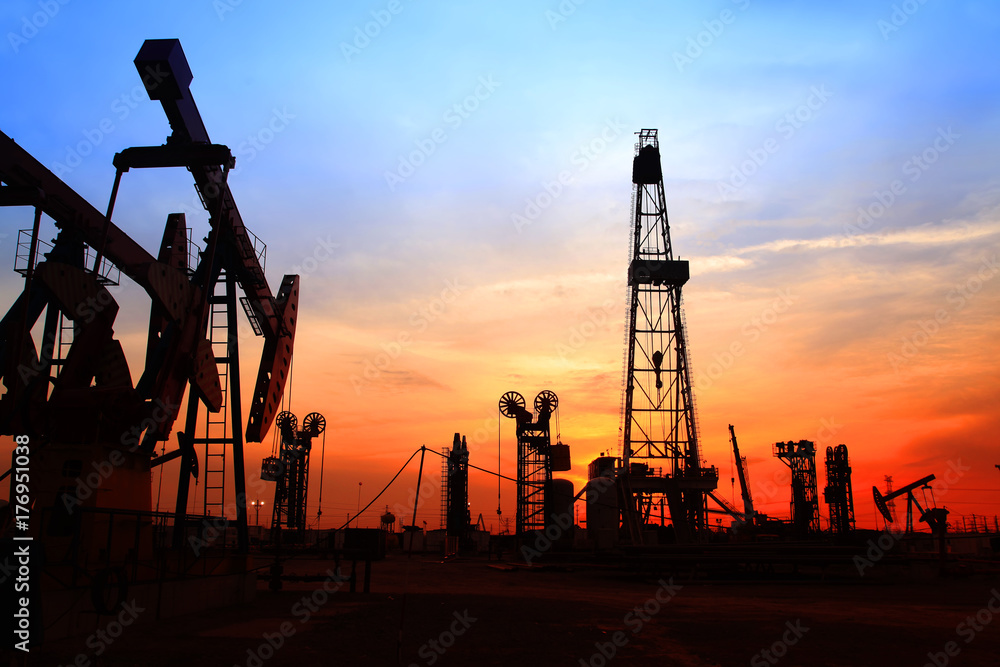 the silhouette of oilfield derrick the silhouette of oilfield derrick