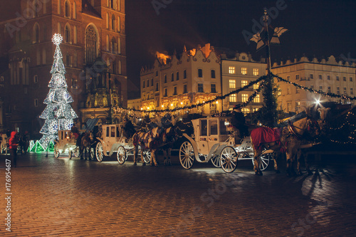 KRAKOW, POLAND - DECEMBER 22, 2016: Annual Christmas market at the Main square (Rynek Glowny). The market starts in the last week of November and lasts through December 26th.
