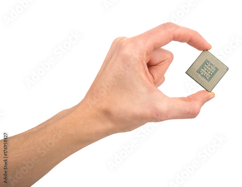 man's hand holding a computer processor