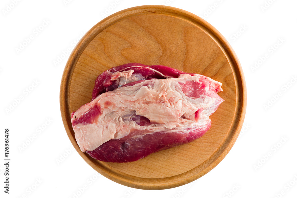 meat on a round cutting board, meat on a white background top