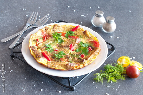 Omelet with eggs, tomato and dill on rye bread