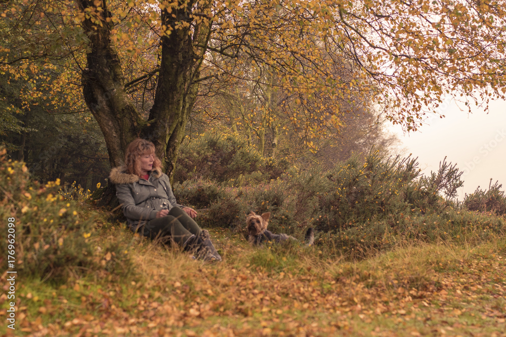 Woman and dog under Tree Woman and dog under Tree