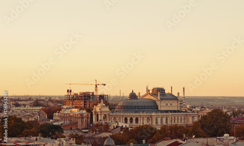 aerial view to Odessa, roofs, port and sea at sunset or sunrise 